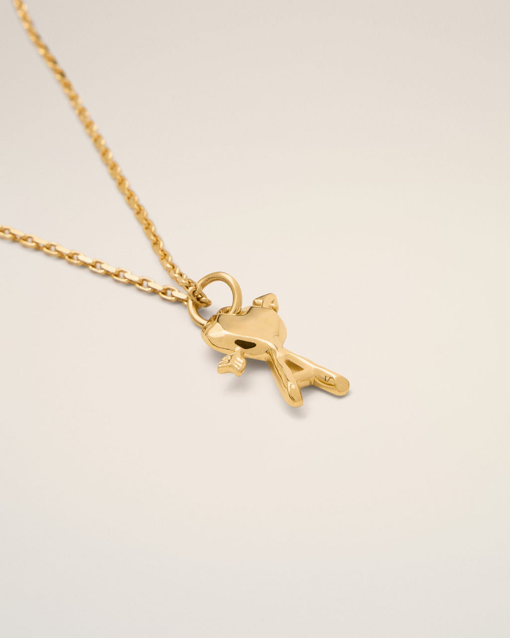 Gold brass necklace with hammered Ami de Coeur arrow